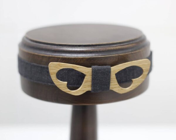 Bow tie in oak wood fly away